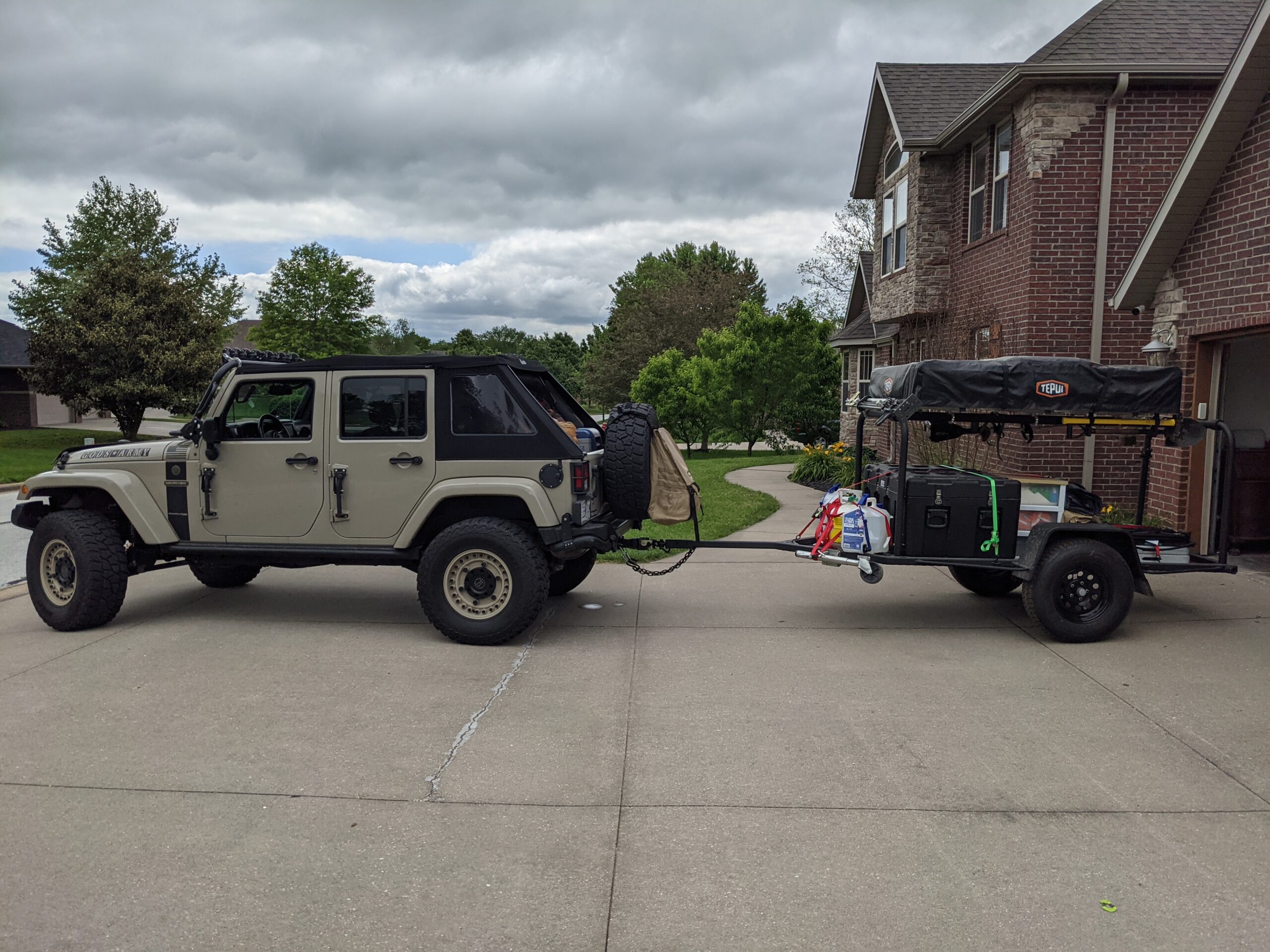 Twain trailer with Tepui rooftop tent towed by a Jeep Wrangler